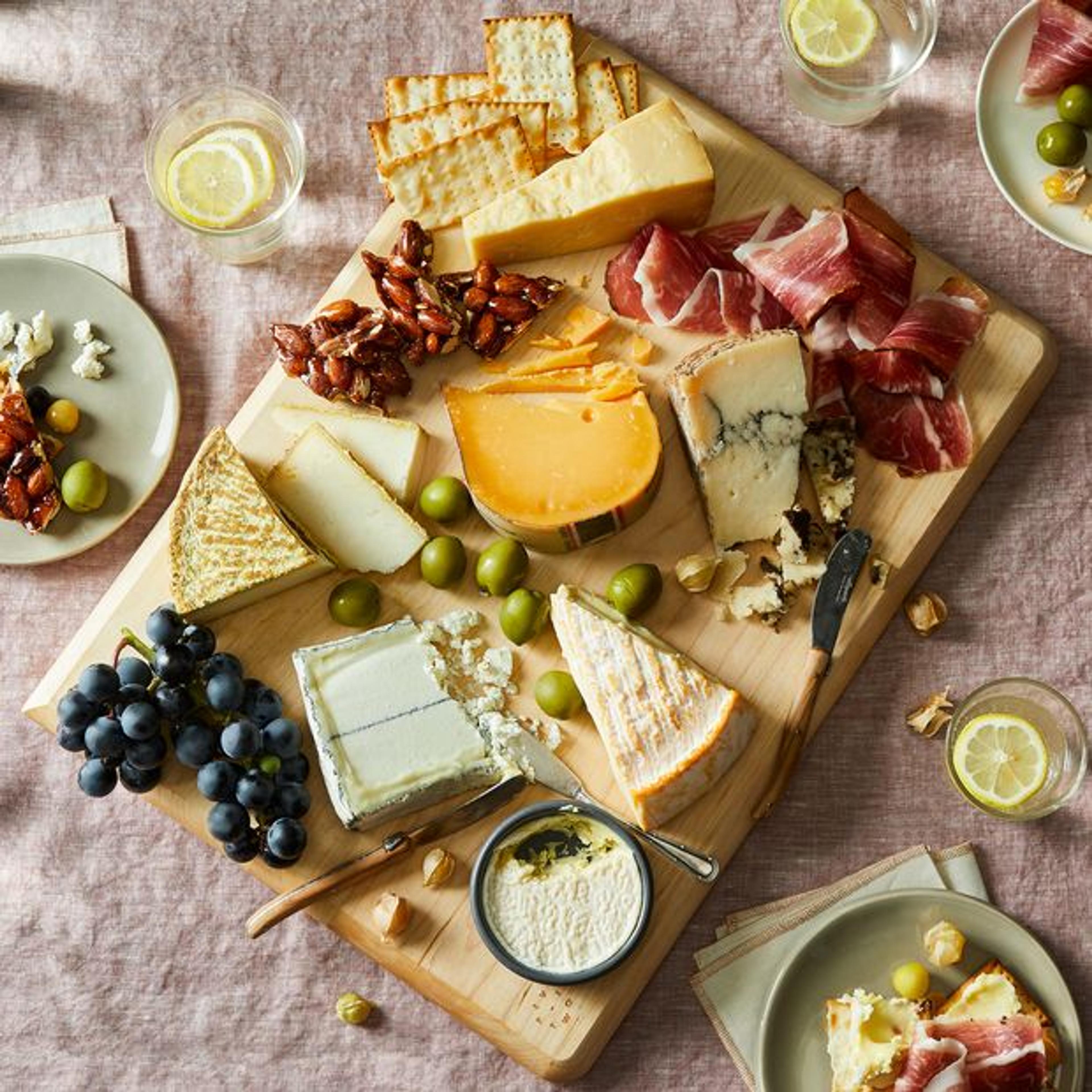 Cutting board with charcuterie meats and cheese