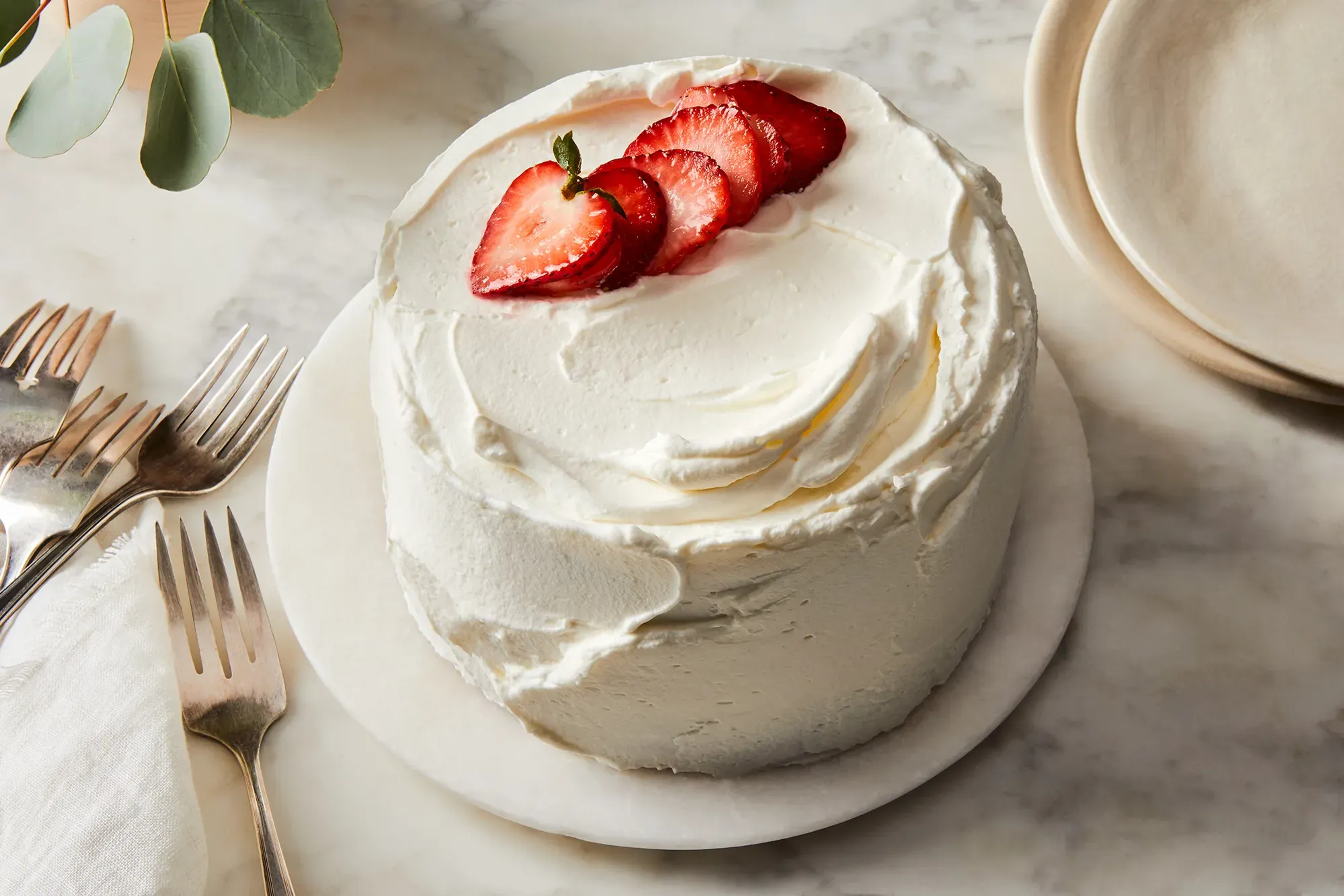 Strawberries on frosted cake