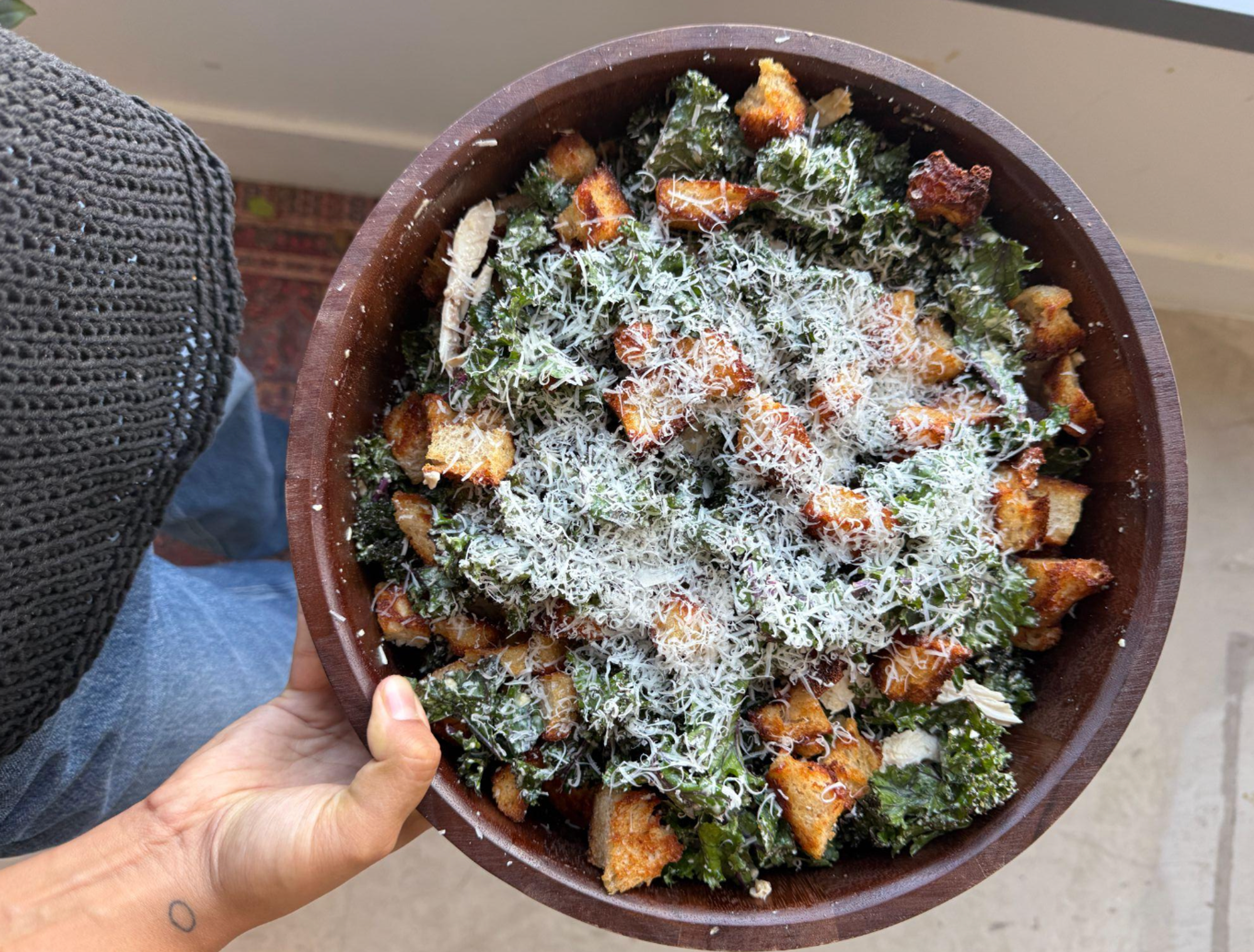 kale caesar salad in salad bowl